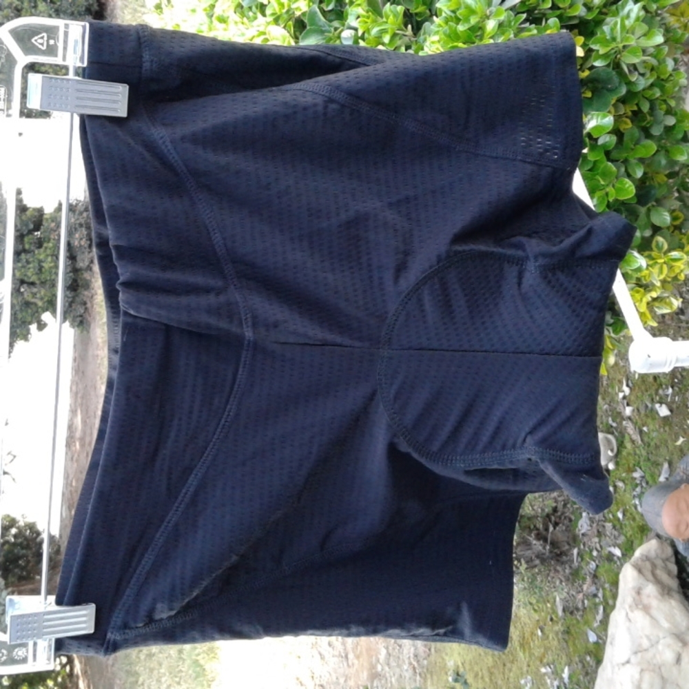 Woman is black biking shorts with cushion in the seat good condition extra large